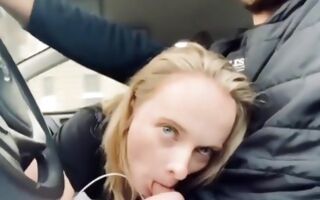 Hot blonde in the car blowing a huge and tasty dick